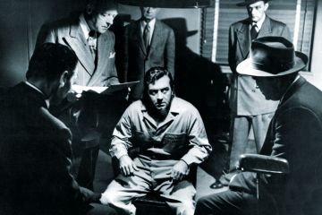 Man being questioned by detectives