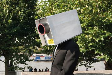A man with a CCTV camera on his head A man with a CCTV camera on his head