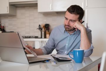 Man frustrated by paperwork