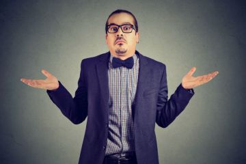 Man in bowtie shrugging Man in bowtie shrugging