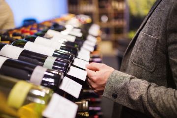 Man picking out wine
