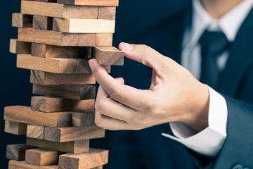 Man playing Jenga Man playing Jenga