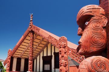 Maori wood carving outside of Te Papaiouru Marae, a Maori meeting house in the tourist town of Rotorua, New Zealand