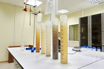 Measuring test tubes with different liquid in laboratory