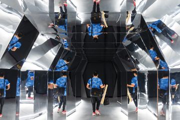 Man reflected in many mirrors