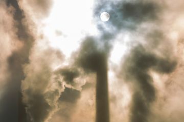 Moonlit sky behind clouds of smoke Moonlit sky behind clouds of smoke