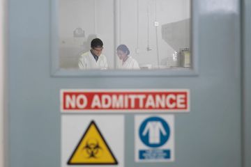 No admittance sign on laboratory door, to illustrate that Trump security crackdown risks undermining US collaboration.