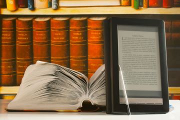 Open book, bookshelf and e-book reader Open book, bookshelf and e-book reader