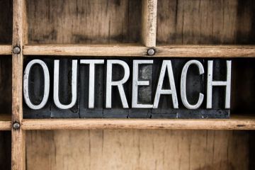 Outreach sign carved in wood Outreach sign carved in wood