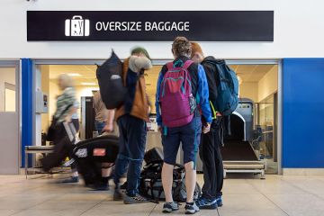 Passengers with luggage queue in front of the airport’s oversized baggage counter. To illustrate that the proposed levy on international students could put jobs at risk, and imposing the levy on students could be too much for them to bear. Passengers with luggage queue in front of the airport’s oversized baggage counter. To illustrate that the proposed levy on international students could put jobs at risk, and imposing the levy on students could be too much for them to bear.