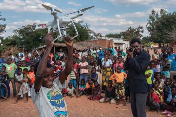 Boy holding drone