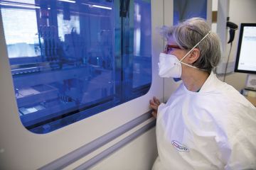 Healthcare workers work on the preparation of evaluation swabs for Coronavirus in research lab of Amedeo di Savoia hospital, Turin, Italy