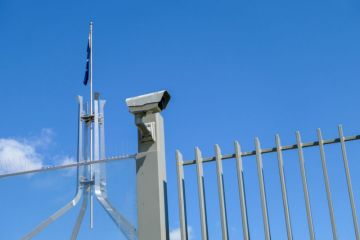 Part of the security barrier protecting the roof of Parliament House in Canberra Part of the security barrier protecting the roof of Parliament House in Canberra
