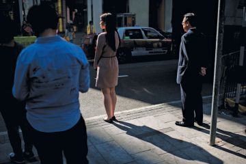 Pedestrians waiting to cross the road, Hong Kong Pedestrians waiting to cross the road, Hong Kong
