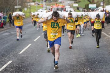 People running in World Coal Carrying Championships, Yorkshire