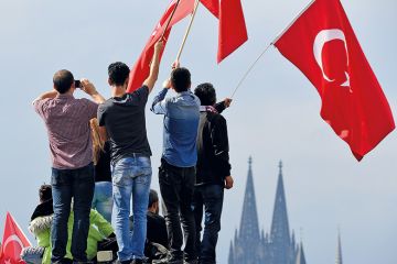 People waving Turkish flag