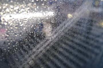 People in the subway station walking using escalator People in the subway station walking using escalator
