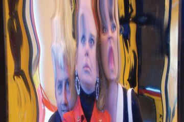 People's faces distorted in hall of mirrors reflection People's faces distorted in hall of mirrors reflection