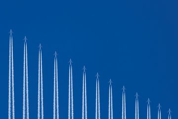 row of planes flying vertically to depict international study