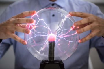 Hands on a plasma globe