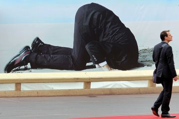 Poster of man with head buried in sand Poster of man with head buried in sand