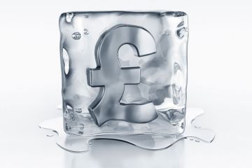 Pound currency symbol frozen in ice block