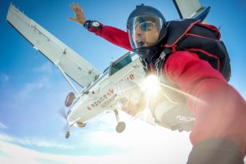 Queenstown, New Zealand - Feb 24, 2017 Skydivers are jumping from the airplane.
