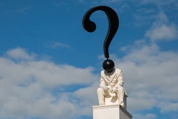 Statue of figure with question mark as head Statue of figure with question mark as head