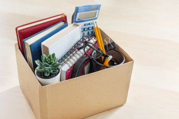 A cardboard box containing a quitting worker's belongings