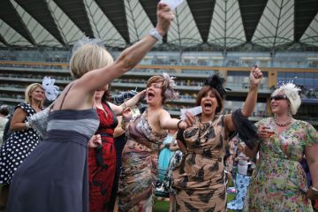 Racegoers celebrate win, Royal Ascot, England Racegoers celebrate win, Royal Ascot, England