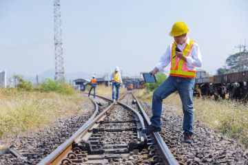 Railway engineers inspect a junction, symbolising university bureaucracy Railway engineers inspect a junction, symbolising university bureaucracy