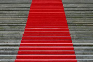 A red carpet up stairs