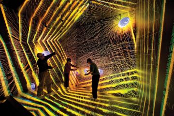 Researchers inside astronomical simulation, Los Alamos National Laboratory