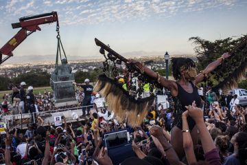 Students cheer as the Cecil Rhodes statue is being removed from the University of Cape Town on April 9, 2015 Students cheer as the Cecil Rhodes statue is being removed from the University of Cape Town on April 9, 2015