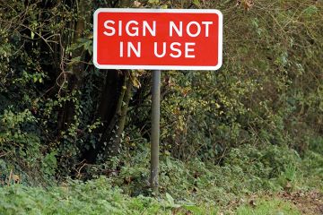 'Sign not in Use' sign on country road