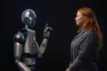 A robot talks to a woman, illustrating AI interactions
