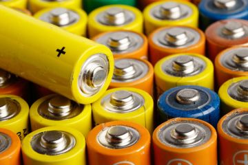 Rows of multi-coloured AA batteries Rows of multi-coloured AA batteries
