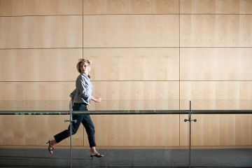 woman running through corridor