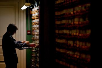 A man looking for items on the shelves (many of which are in the dark) in the Russian State Library in Moscow, Russia, 2018. To illustrate that a lack of archival access have transformed Russia studies A man looking for items on the shelves (many of which are in the dark) in the Russian State Library in Moscow, Russia, 2018. To illustrate that a lack of archival access have transformed Russia studies