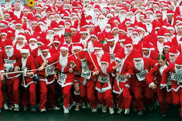 Marathon runners dressed as Santa Claus Marathon runners dressed as Santa Claus