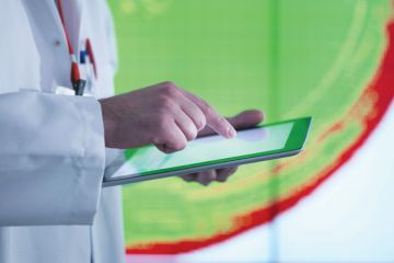 Scientist working with touchscreen tablet device