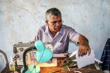 Sewing name badges for customers in Anuradhapura, Sri Lanka