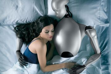 Sex robot. Woman in bed with robot Sex robot. Woman in bed with robot