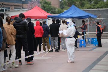 Shanghai,China-March 19th 2022 many Chinese people line up to receive nucleic acid test for Covid-19 coronavirus at local community. Shanghai is seeing a resurgence of covid-19 Omicron