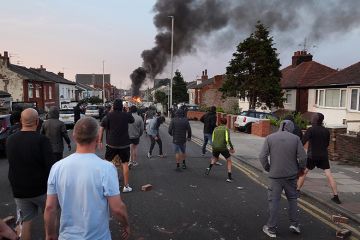 Protesters throw stones at police after disorder broke out on July 30, 2024 in Southport, England. Rumours about the identity of the 17-year-old suspect in yesterday's deadly stabbing attack here have sparked a violent protest. Protesters throw stones at police after disorder broke out on July 30, 2024 in Southport, England. Rumours about the identity of the 17-year-old suspect in yesterday's deadly stabbing attack here have sparked a violent protest.