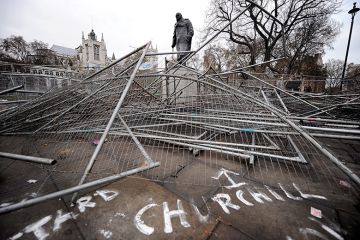Statue of Winston Churchill, broken security barriers, Parliament Square, London