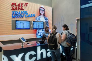 Storefront to a money or currency exchange at Sydney Kingsford-Smith International Airport Storefront to a money or currency exchange at Sydney Kingsford-Smith International Airport