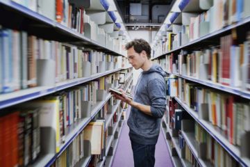 Student in university library