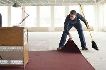 Someone sweeping something under the carpet