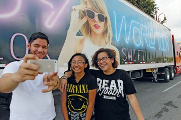 Taylor Swift fans in Houston Taylor Swift fans in front of one of the many semi-trucks in Houston to illustrate For Taylor Swift, lecturers find a place in this world